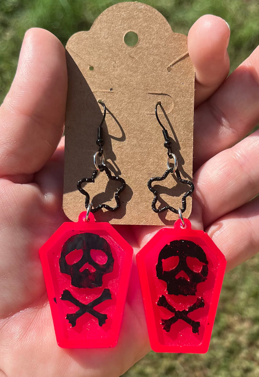 Coffin shaped earrings with skulls